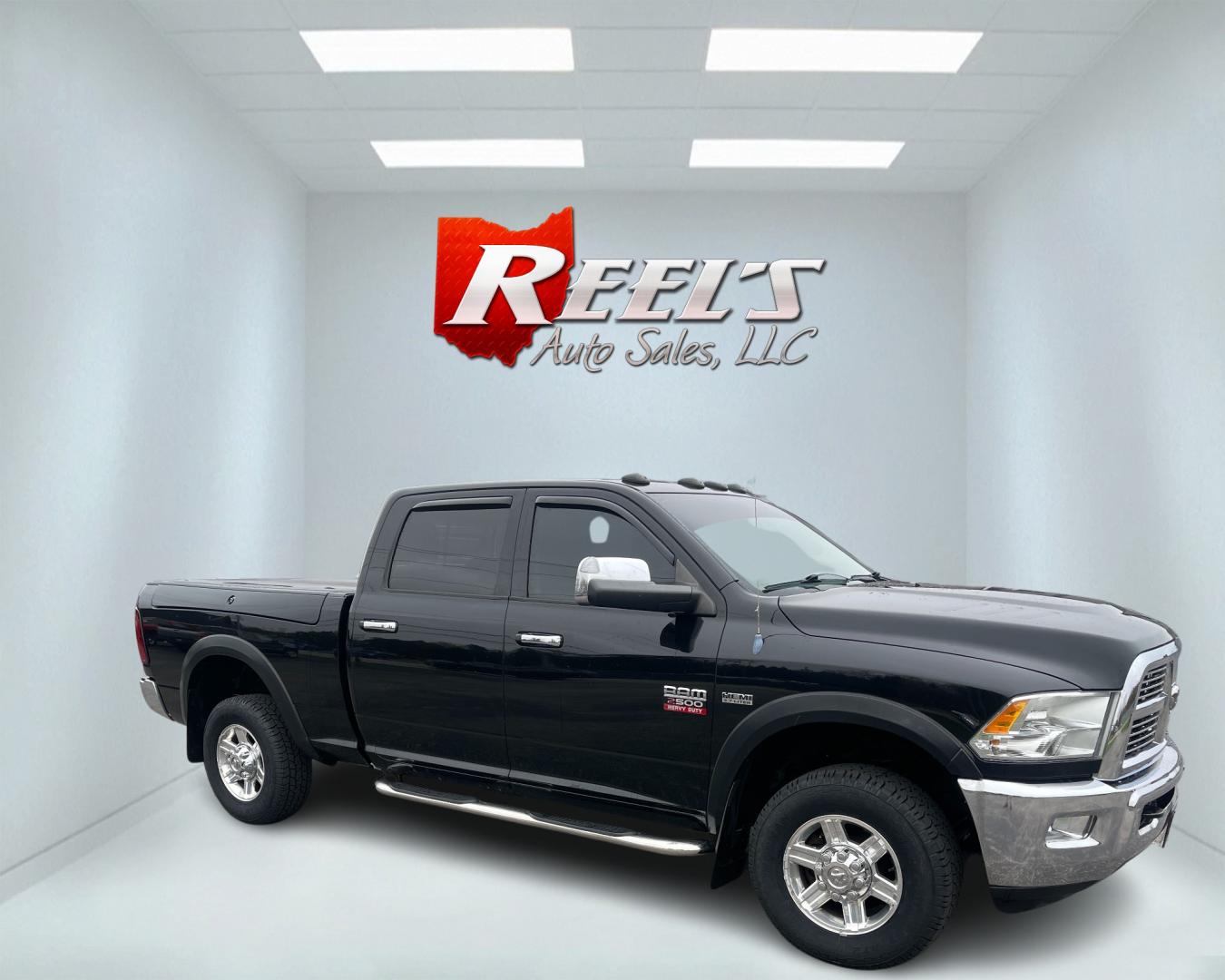 2012 Black /Black Dodge Ram 2500 Laramie Crew Cab SWB 4WD (3C6TD5FT6CG) with an 5.7L V8 OHV 16V engine, 6-Speed Automatic transmission, located at 547 E. Main St., Orwell, OH, 44076, (440) 437-5893, 41.535435, -80.847855 - This 2012 Dodge Ram 2500 Laramie Crew Cab is a heavy-duty pickup truck designed for serious towing and hauling capabilities. Powered by a 5.7L HEMI V8 engine mated to a 6-speed automatic transmission and 3.73 gearing, it boasts an impressive 10,550-pound towing capacity. The interior is well-appoint - Photo#3